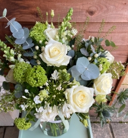 Stunning eco vase arrangement in white and green.